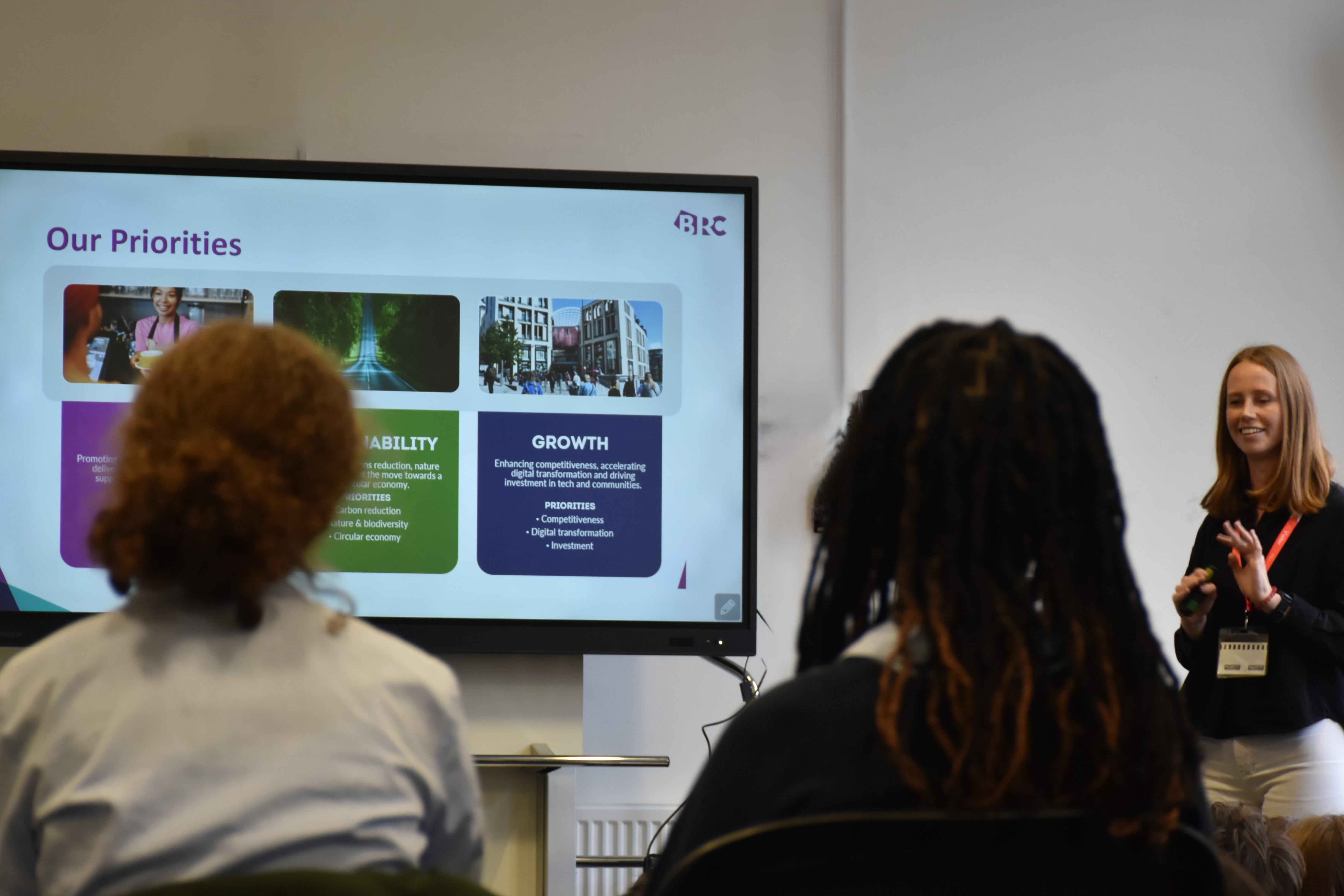 Sophie presents slides to students