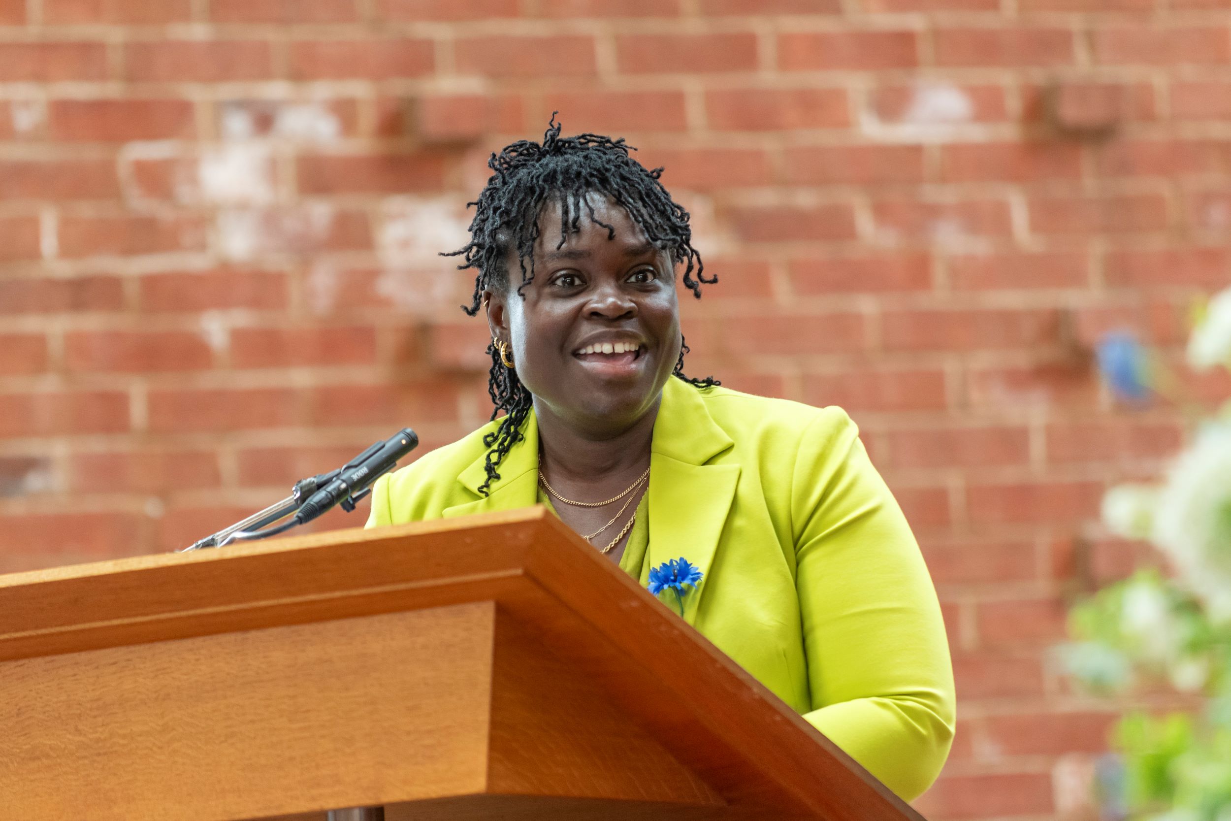 EAC President Aisha Bywaters (Brown's 2002) delivers her welcome address