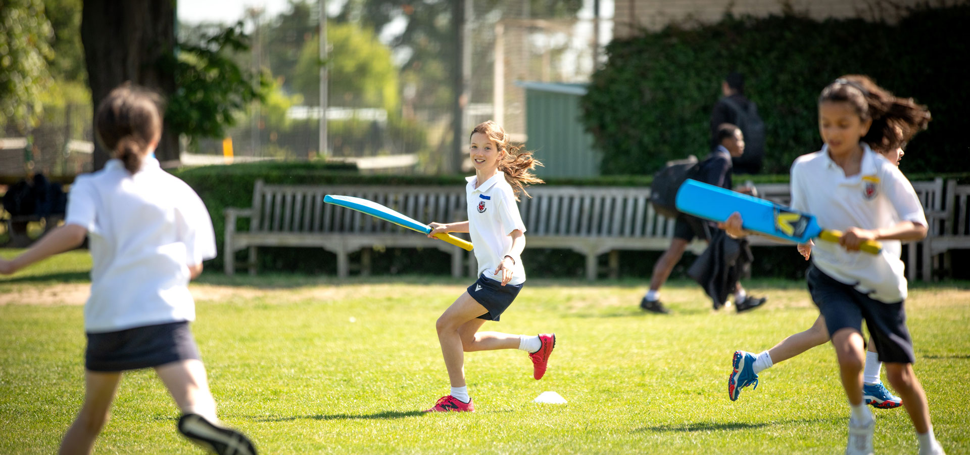 Junior school students playing sports on the Alleyn's sports facilities.
